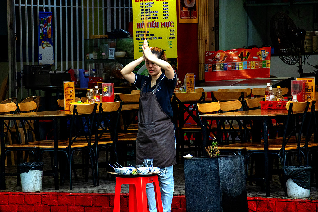 Waitress praying before start of business day on 5-19-24--Vung Tau copy