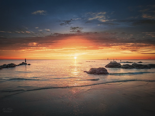 Thailand Hua Hin by Ed Kruger, Sunrise serenity at Hua Hin beach. The gentle lapping of the waves against the shore creates a calmi