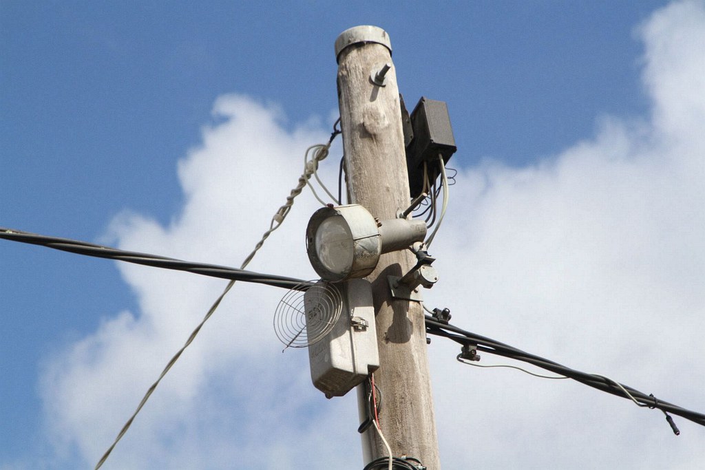 Damaged 'Watchman' security light pointed towards a public… | Flickr