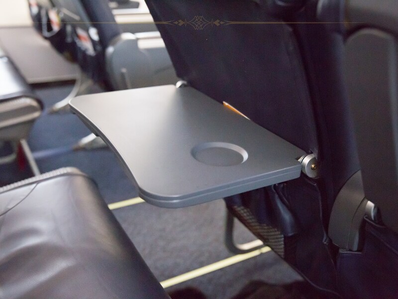 A close-up of an airplane tray table.