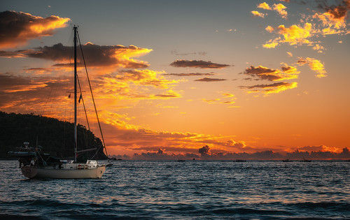 Romantic sunset by pavel.haiduk, golden orange sunset romantic beach getaway seashore serenity waves water pacific ocean yacht mexico