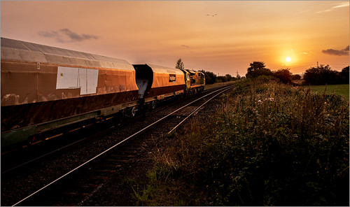 Coal Sunset by Terry 47401, With the sun rapidly sinking in the west 70004 The Coal Industry Society zips away from Whitley Brid