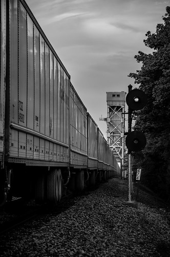 With Such Sweet Sorrow by Brenden Albert, With a filtered sunset giving way to nightfall, NS 255 and its 90 Roadrailer Trailers are seen cross