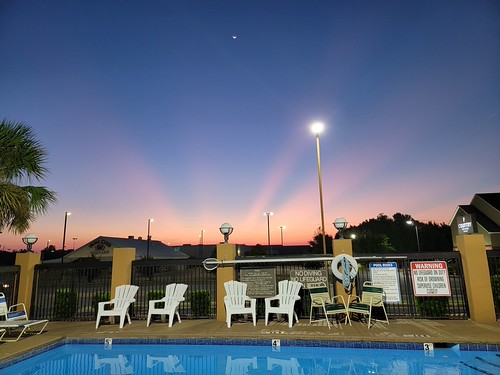 A Fabulous Sunrise this Morning 8/30/24 by perfect_man4noone, The sunbeam blast out of the horizon and the quarter moon high in the sky