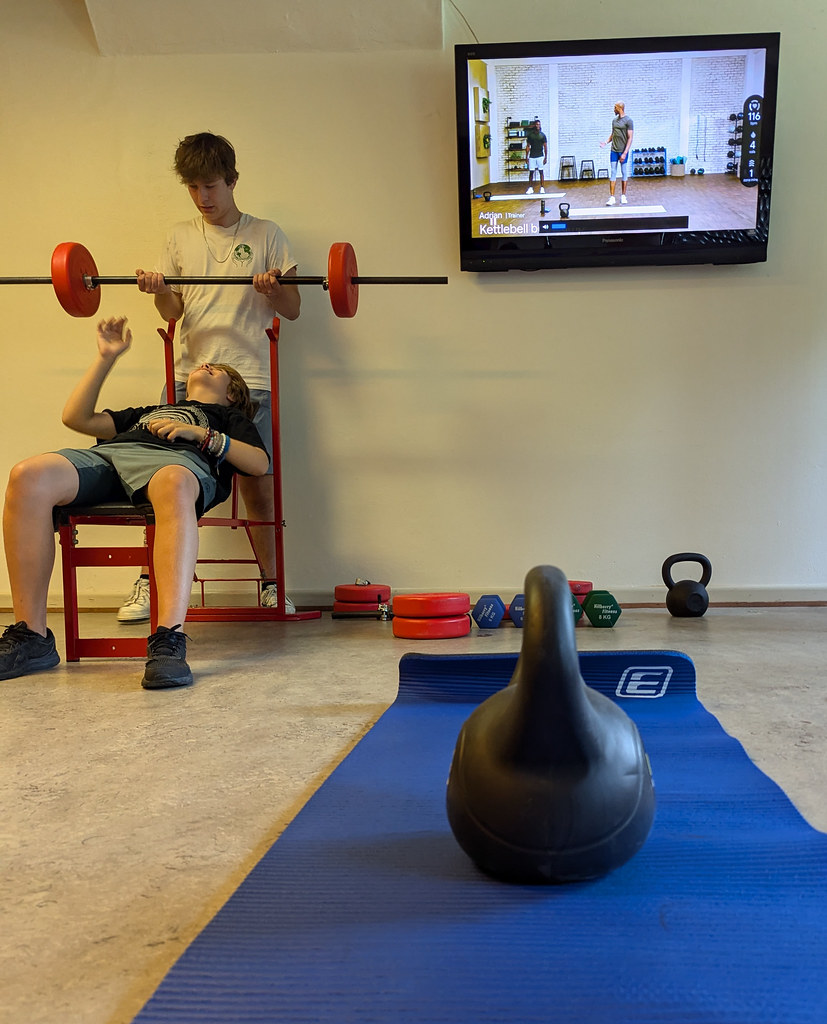 The kids bench press. Signe and I are doing a Fitbit kettlebell class.