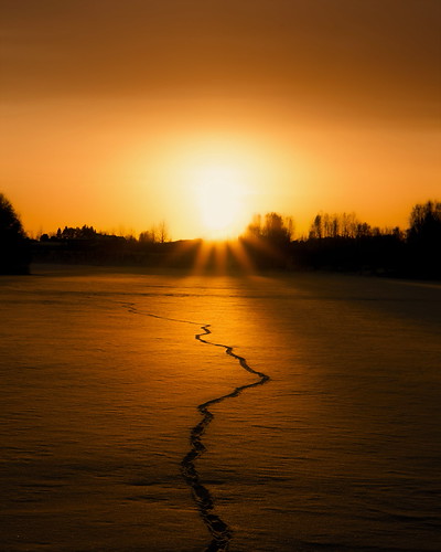 Footprints & Sunset by Kim Lundström, This photo was taken in Umeå, Sweden.sunset