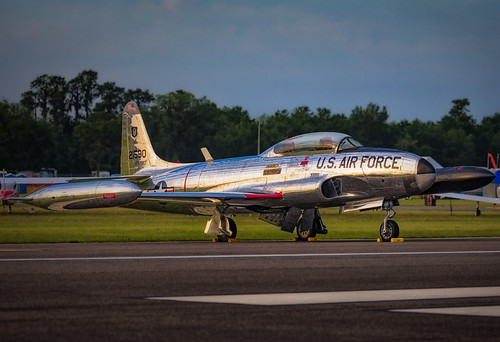 Lockheed T-33 Shooting Star at Sunset by A.Fabbrini, The sleek and polished Lockheed T-33 Shooting Star, shimmering under the golden hues of sunset at Su