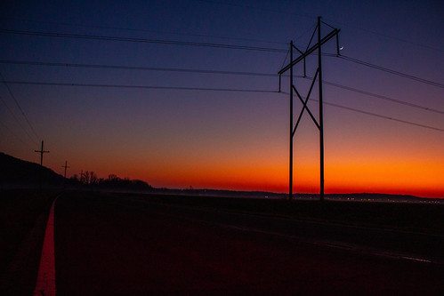 Sunset at Atherton by MidwesternRailfan, A deep orange sunset covers the western horizon over the hazy fields south of Atherton on a chilly J