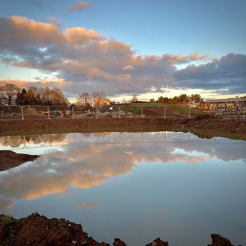 A Construction Site Sunset by barronr, gb scotland westlothian livingston sunset sun light sky cloud colour water reflection fence herras c