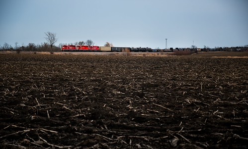 Take the Open Road by Brenden Albert, As sunset encroaches on the landscape, CPKC 247 is seen whaling through the open countryside near So