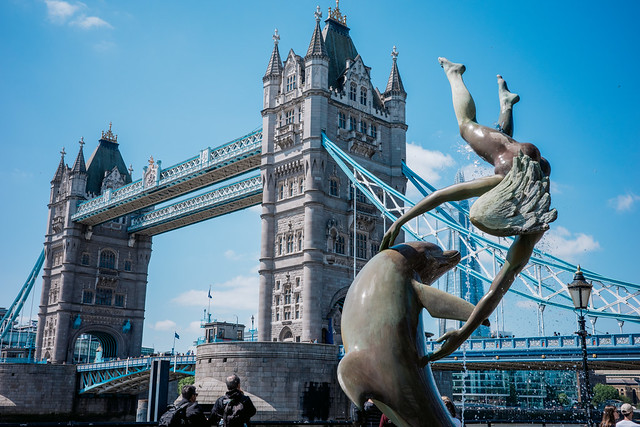Tower Bridge with Girl and Dolphin Statue in London