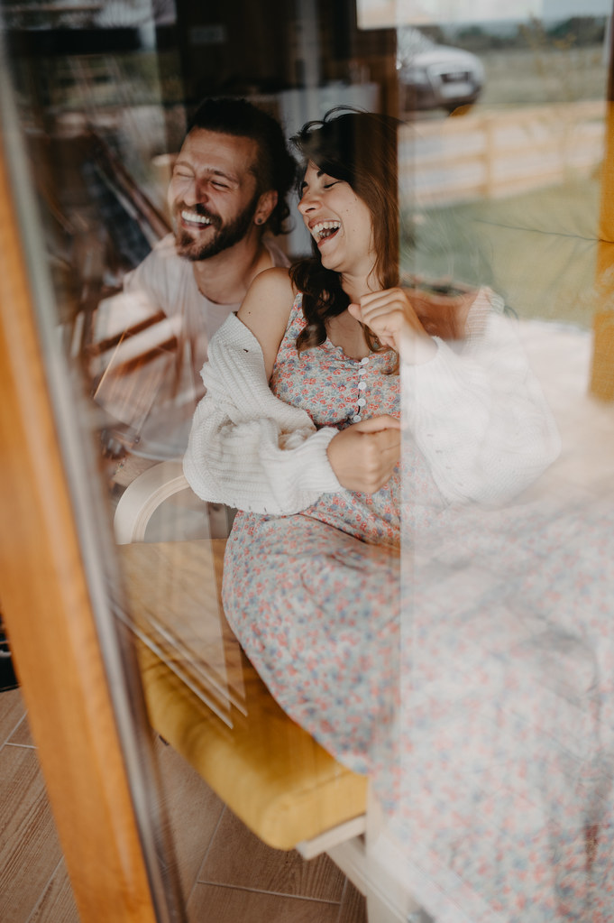 A couple relaxes together in a bright