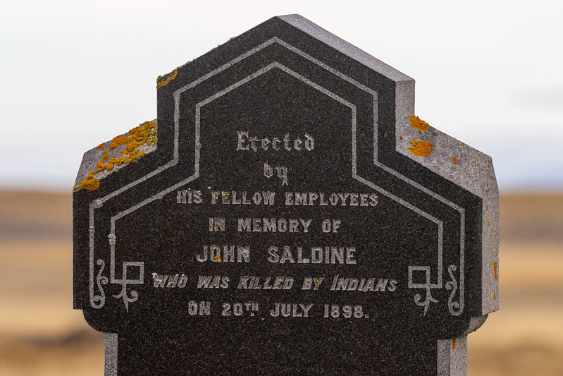 A gravestone in the nearby cemetery... no mention of how many locals John killed before they got to him...