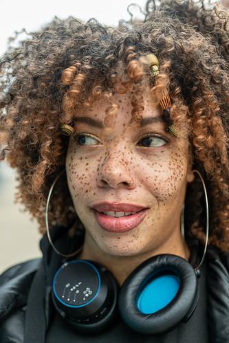 Close up portrait of woman with headphones | by Rushay
