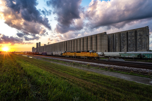 Geeps in the Evening by hunter.the.photographer, With the sun setting over Union Pacific's yard in Topeka, KS, a GP60E and a GP40N sort cars for thei