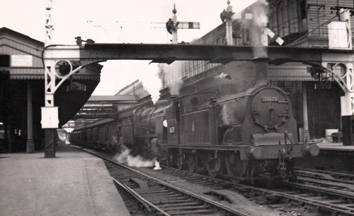 A heavy ballast train about to attack the incline from St Davids to Exeter Central, with Class M7 0-4-4T 30670 piloting Class N 2-6-0 31847. Two E1R 0-6-2Ts, 32124 & 32135 are on the rear of the train, August 1952. | by colin9007