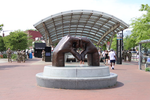 Loveful Hands bronze sculpture by Jay Coleman at Eastern Market Metro Plaza in Washington DC