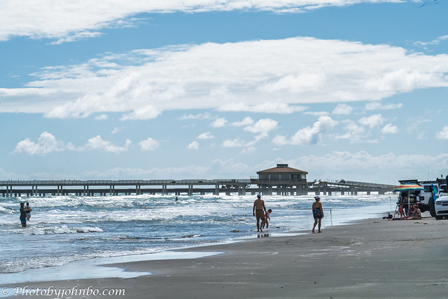Beachgoers near the Bob Hall Pier