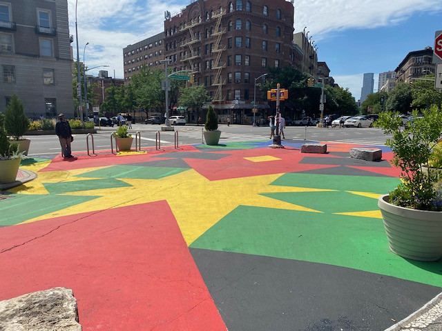 Colorful mural at the pedestrian plaza by West 116th Street and St. Nicholas Avenue.