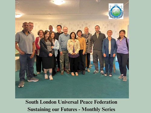 [Describe what is happening in the photo here, e.g., Panelists speaking at the South London Universal Peace Federation seminar]