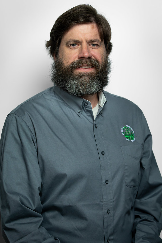 Portrait of a man with dark hair, beard