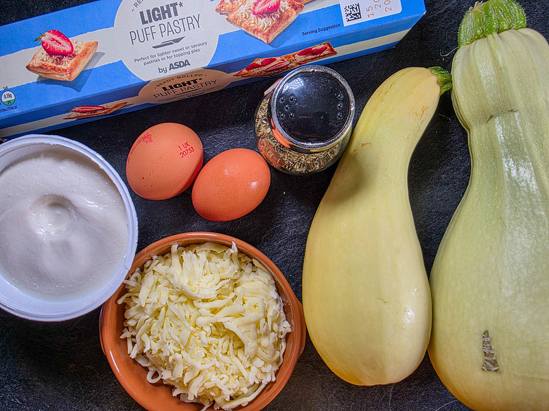 2 large zucchini, 2 eggs, a pack of puff pastry, a can of ricotta cheese, a ramekin with grated cheese