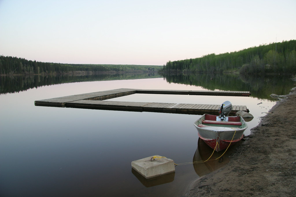 Dock and boat at Rainbow Lake Provincial Recreation Area