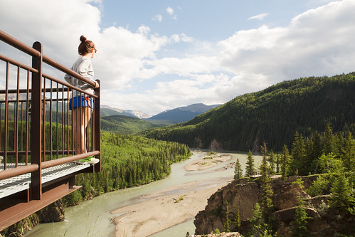 Woman on a viewing platform overlooking the river at Sulphur Gates Provincial Recreation Area