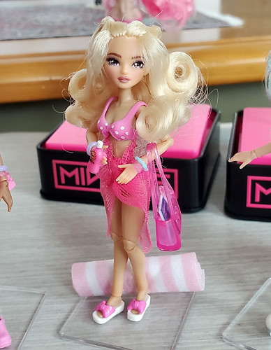Retro Roller Beach Version in her itsy bitsy teeny weeny PINK polka dot bikini.  :>)