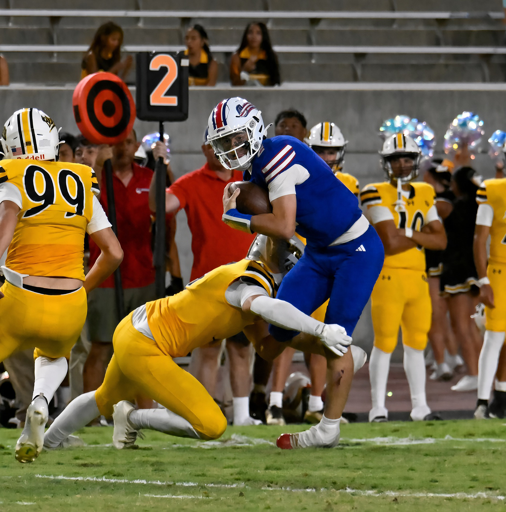 Tommy Devany breaks one of several tackles on this QB keeper