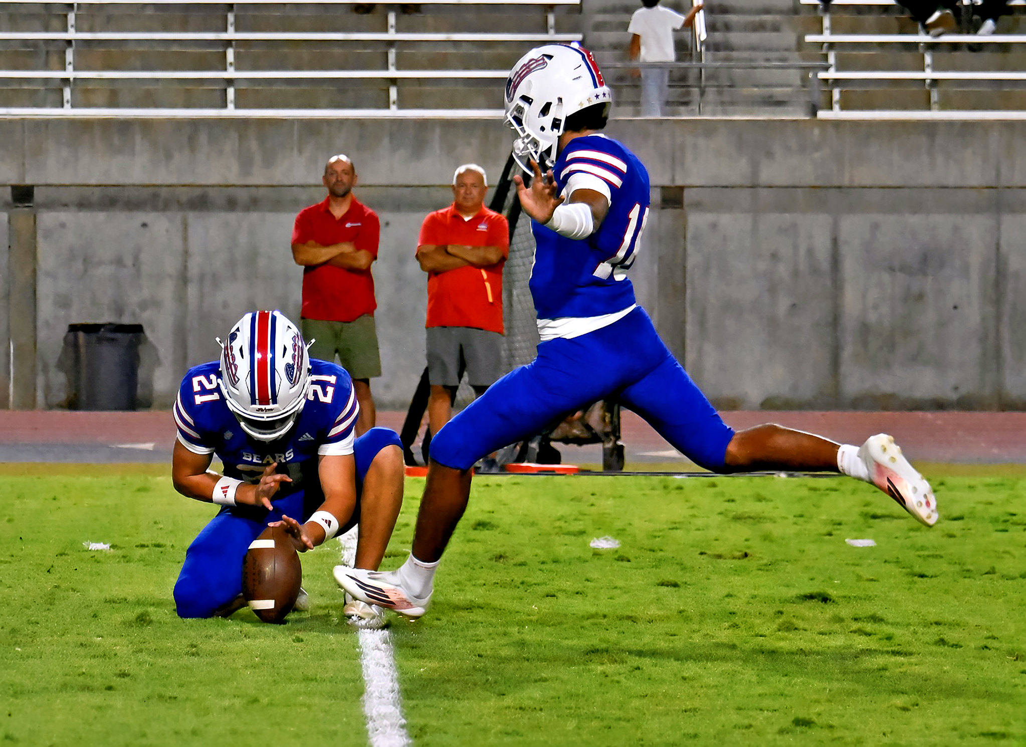 Nate Castro with the extra point with Garrett Aviles holding.