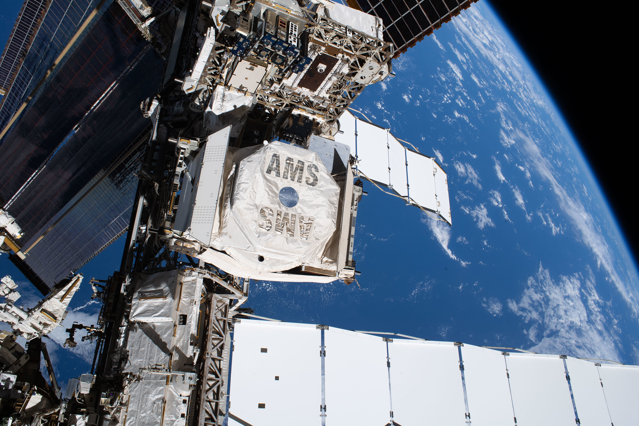 The Alpha Magnetic Spectrometer (AMS), a cosmic particle detector