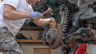 The hardest part about removing the CVs is getting the cover for the axle nut removed. I always feel like I'm going to destroy this little cover as I bash on it with the hammer and screwdriver.
