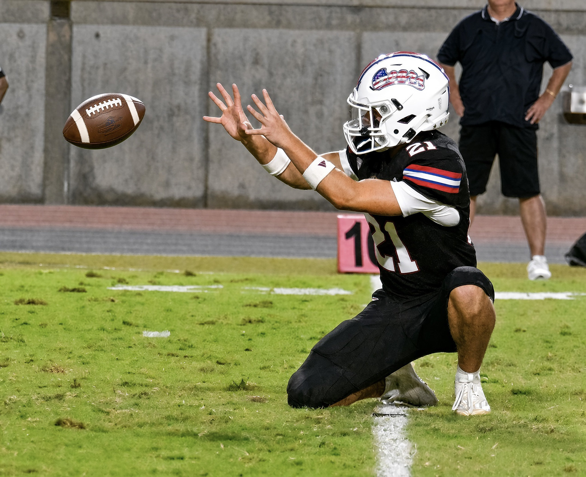 Garrett Aviles holds for an extra point