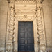 <p><a href="https://www.flickr.com/people/geertfotografeert/">geertfotografeert</a> posted a photo:</p>
<p><a href="https://www.flickr.com/photos/geertfotografeert/55538195100/" title="Sicily - Syracuse: Cathedral of Syracuse - main entrance"><img src="https://live.staticflickr.com/65535/55538195100_19af13669c_m.jpg" width="180" height="240" alt="Sicily - Syracuse: Cathedral of Syracuse - main entrance" /></a></p>
<p>Main entrance of the cathedral. The doorway is flanked by two striking Solomonic columns (spirally twisted), richly decorated with reliefs of grapevines.<br />
<br />
The Cathedral of Syracuse (officially the *Cattedrale metropolitana della Natività di Maria Santissima*) was built within and around a 5th-century BC Greek temple—the Temple of Athena. The massive Greek columns remain clearly visible today in both the exterior and interior walls of the church. The pagan temple was converted into a basilica by the Christian Bishop Zosimus; the spaces between the Greek columns were walled in to form the church's exterior walls. Following the Arab conquest in the 9th century, the building served temporarily as a mosque. In 1086, the Normans restored the church to Christian use and added features such as the wooden roof of the nave. After a severe earthquake destroyed part of the church in 1693, the architect Andrea Palma designed the current, theatrical façade in the lavish Sicilian Baroque style.<br />
<br />
Syracuse (Italian: *Siracusa*) is a port city on the southeastern coast of Sicily. It was once one of the most powerful cities in the ancient Greek world, rivaling Athens in size and influence. The city is essentially divided into two major attractions: the historic island of Ortigia (the city's heart) and the archaeological park on the mainland.</p>