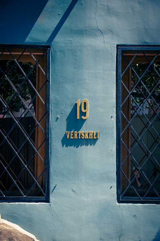 Number Nineteen: blue, wall, shadows, and windows.