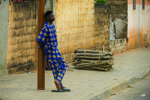 Woman in blue on an Ouidah street
