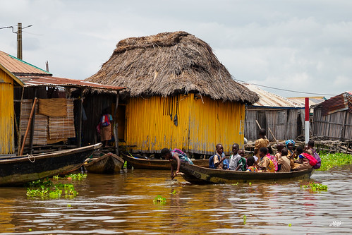 Canoe passing a stilt village, Ganvie, Benin