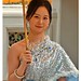 Smiling woman with a yellow parasol, Temple of the Reclining Buddha, Bangkok, July 26, 2026