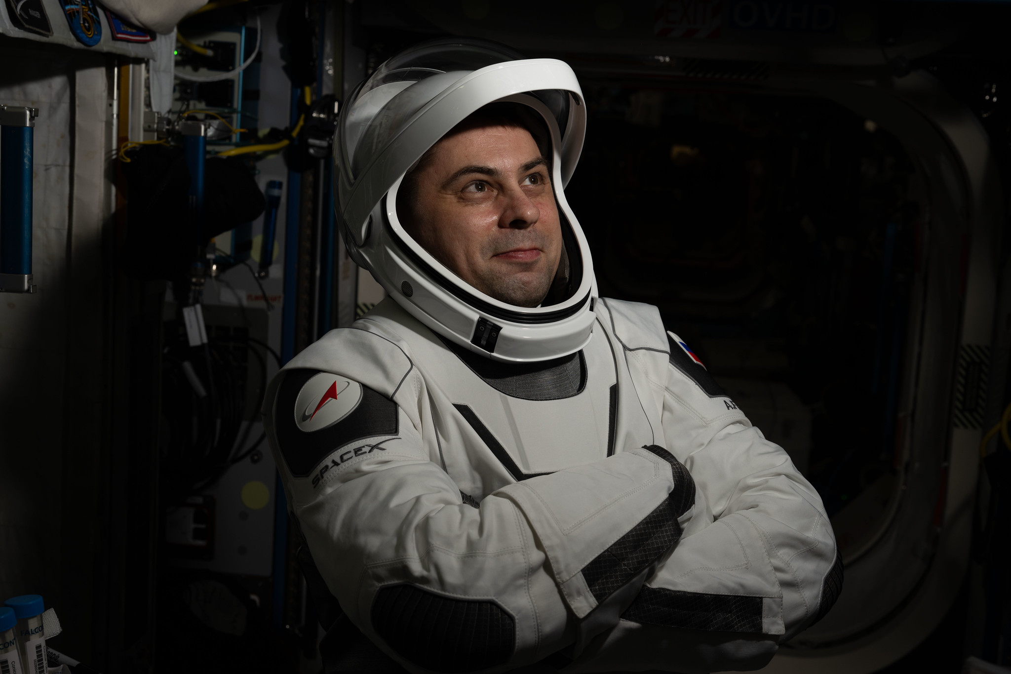 Roscosmos cosmonaut Andrey Fedyaev poses for a portrait while wearing his SpaceX Dragon pressure suit