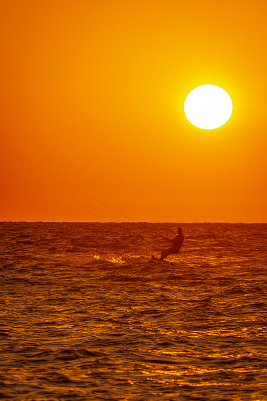 Into the Fire: sunset, kitesurfing, sea, and silhouette.