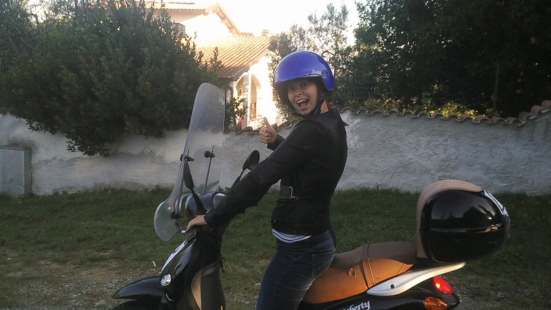 Me on an orange motorino, in rural Tuscany