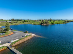Aerial scenic views over Carcoar Dam with blue sky