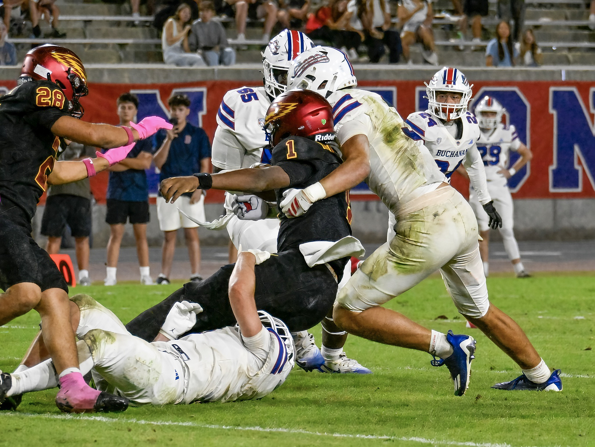 Grant Moser and Logan Hewitt team up on a tackle