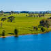 Aerial scenic views over Carcoar Dam with blue sky