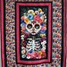 			<p><a href="https://www.flickr.com/people/needleloca/">Needleloca</a> posted a photo:</p>
	
<p><a href="https://www.flickr.com/photos/needleloca/55590301219/" title="La Cat-trina quilt"><img src="https://live.staticflickr.com/65535/55590301219_f4a77ea486_m.jpg" width="180" height="240" alt="La Cat-trina quilt" /></a></p>

<p>Started 5/5/2025<br />
Top completed 5/13/2025<br />
Finished 10/5/2026 <br />
Fabrics from the Day of the Dead line by Timeless Treasures and a raspberry batik fabric for border</p>
