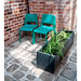 Three green chairs and a planter