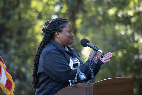 A woman talks at a podium