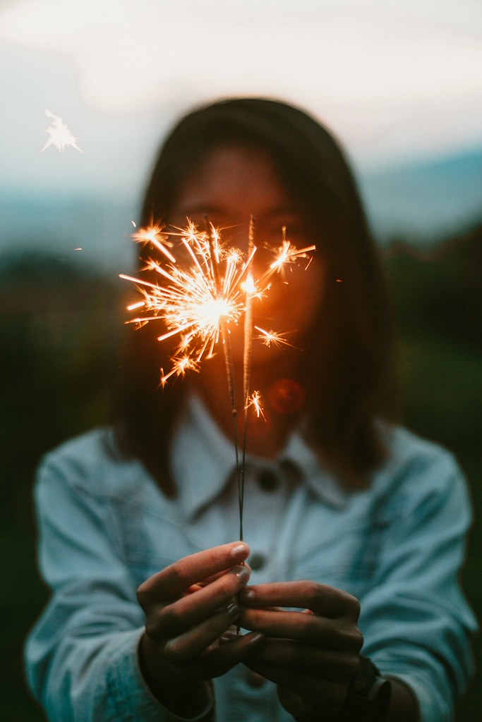 person holding a sparkler
