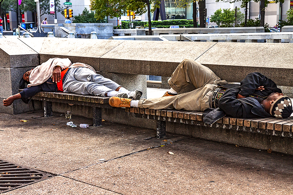 Two-men-sleeping-on-benches-outside-City-Hall--Center-City